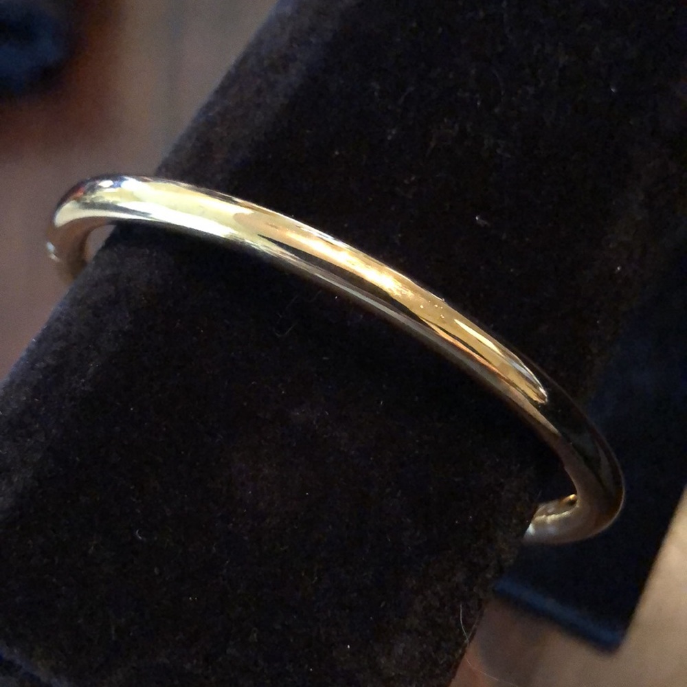 Classic oval hinged rounded gold tone bangle bracelet, stack or wear alone